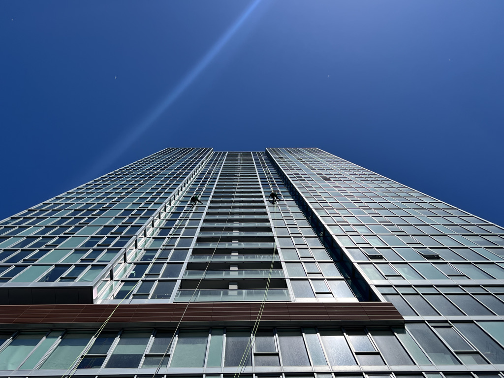 High-rise window cleaners climbing on a building in Chicago