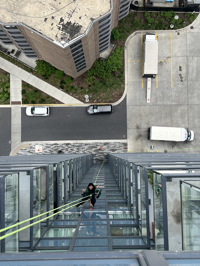 Window washer descending down a high rise building in Chicago