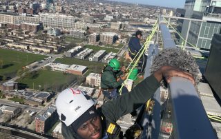 Ascent team washing a Chicago high-rise building with proper equipment