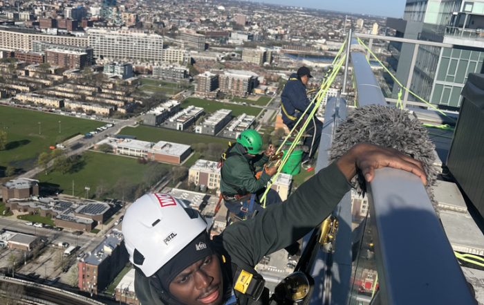 Ascent team washing a Chicago high-rise building with proper equipment