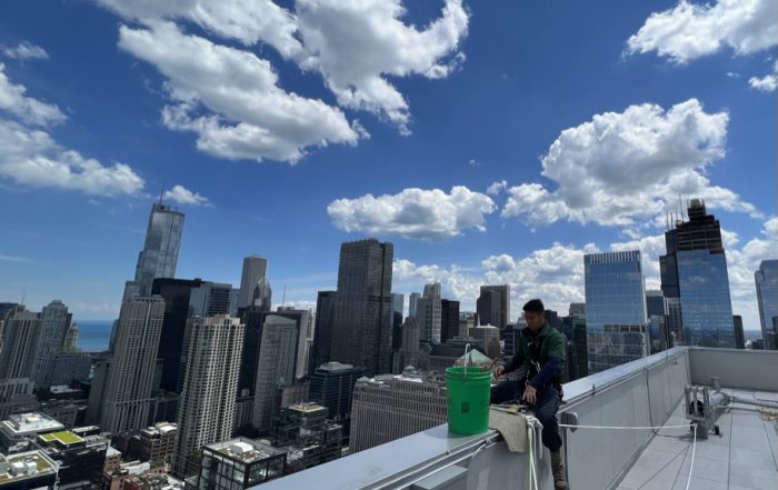 Window washer with all his safety gear getting ready to clean a Chicago skyscraper