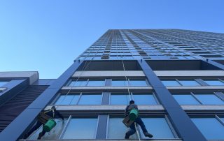 Window washers cleaning the windows of a Chicago high rise building.