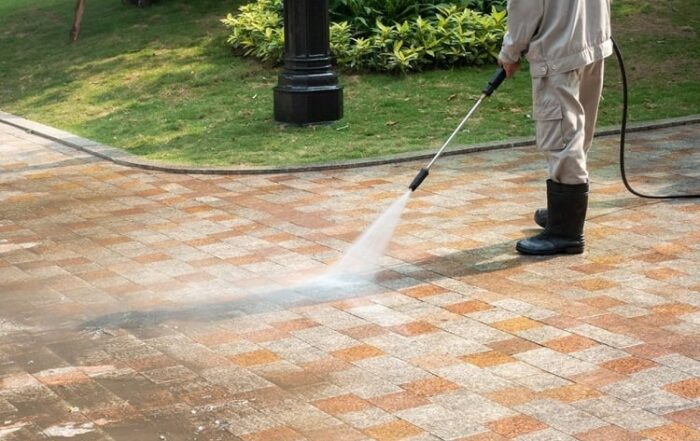 Man power washing a sidewalk in Chicago, IL